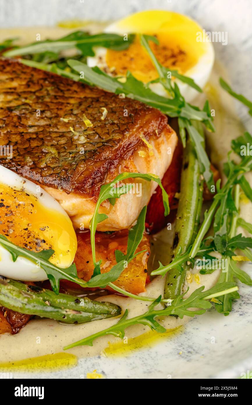 fried fish in a side dish on a plate Stock Photo