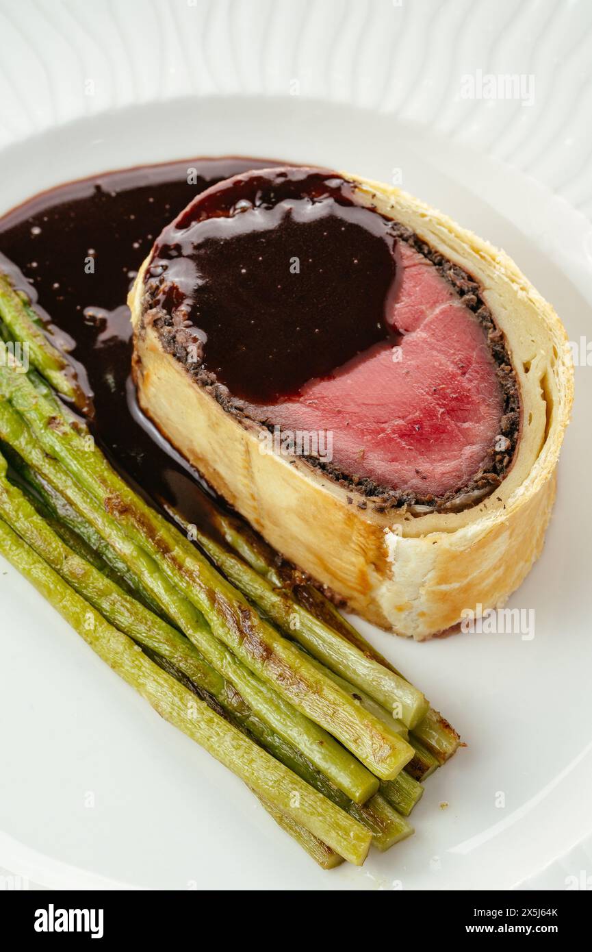 English shepherd's pie with asparagus and sauce on a plate Stock Photo