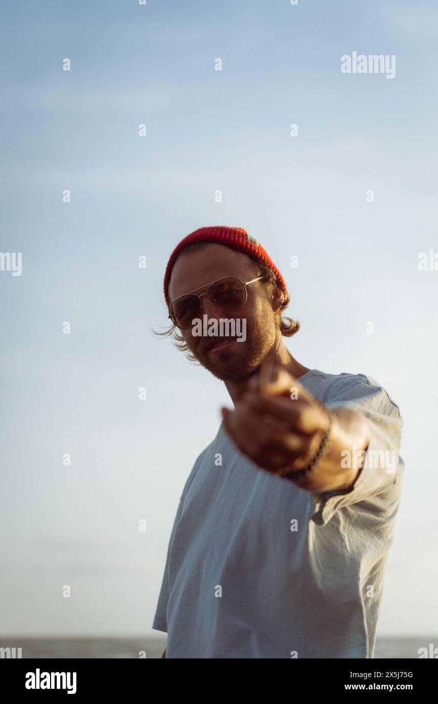 Young man in a red knitted hat. Stock Photo