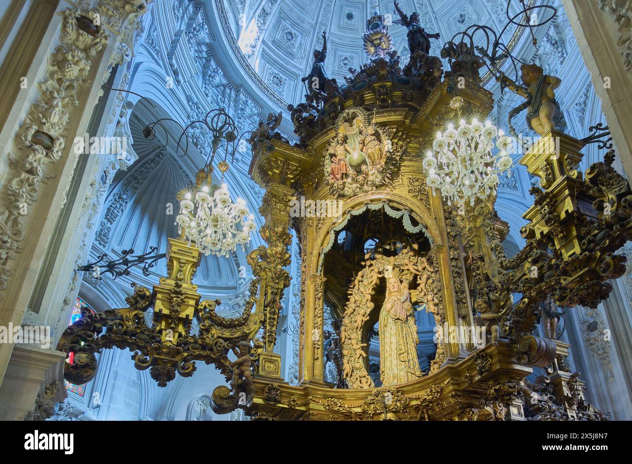 Lugo, Spain - May 10, 2024: A highly detailed golden sanctuary houses the statue of the Virgin with large eyes at the Santa Maria Cathedral in Lugo, S Stock Photo