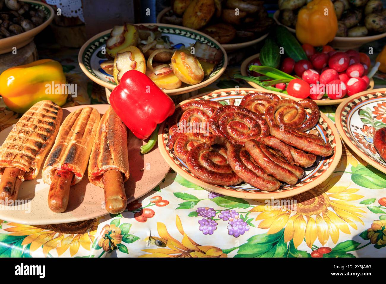 Ukraine, Kiev, Kyiv. Pork and beef wurst being served at a picnic. Village of Olkhovsky outside the city. Stock Photo