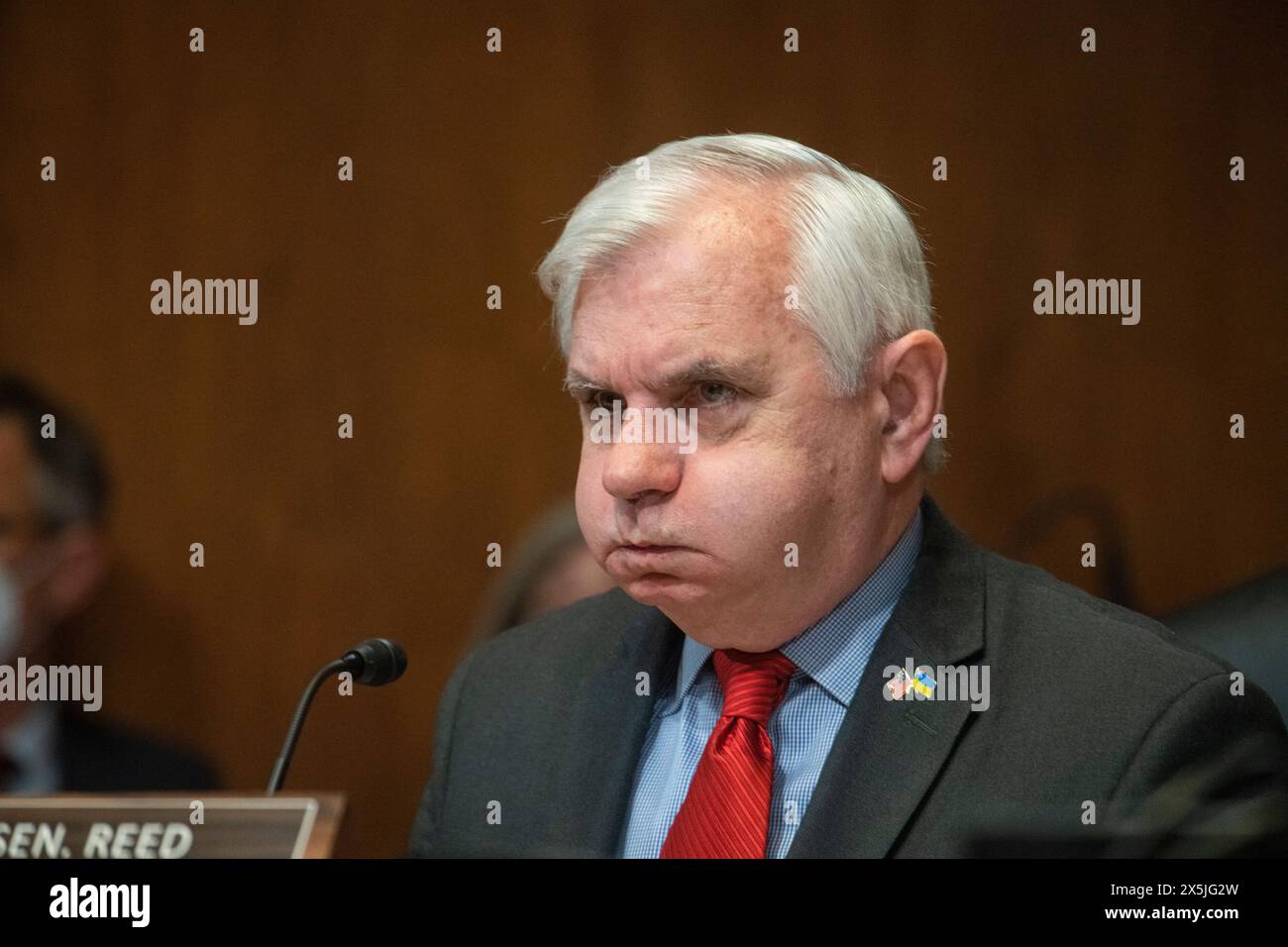 United States Senator Jack Reed (Democrat of Rhode Island) listens