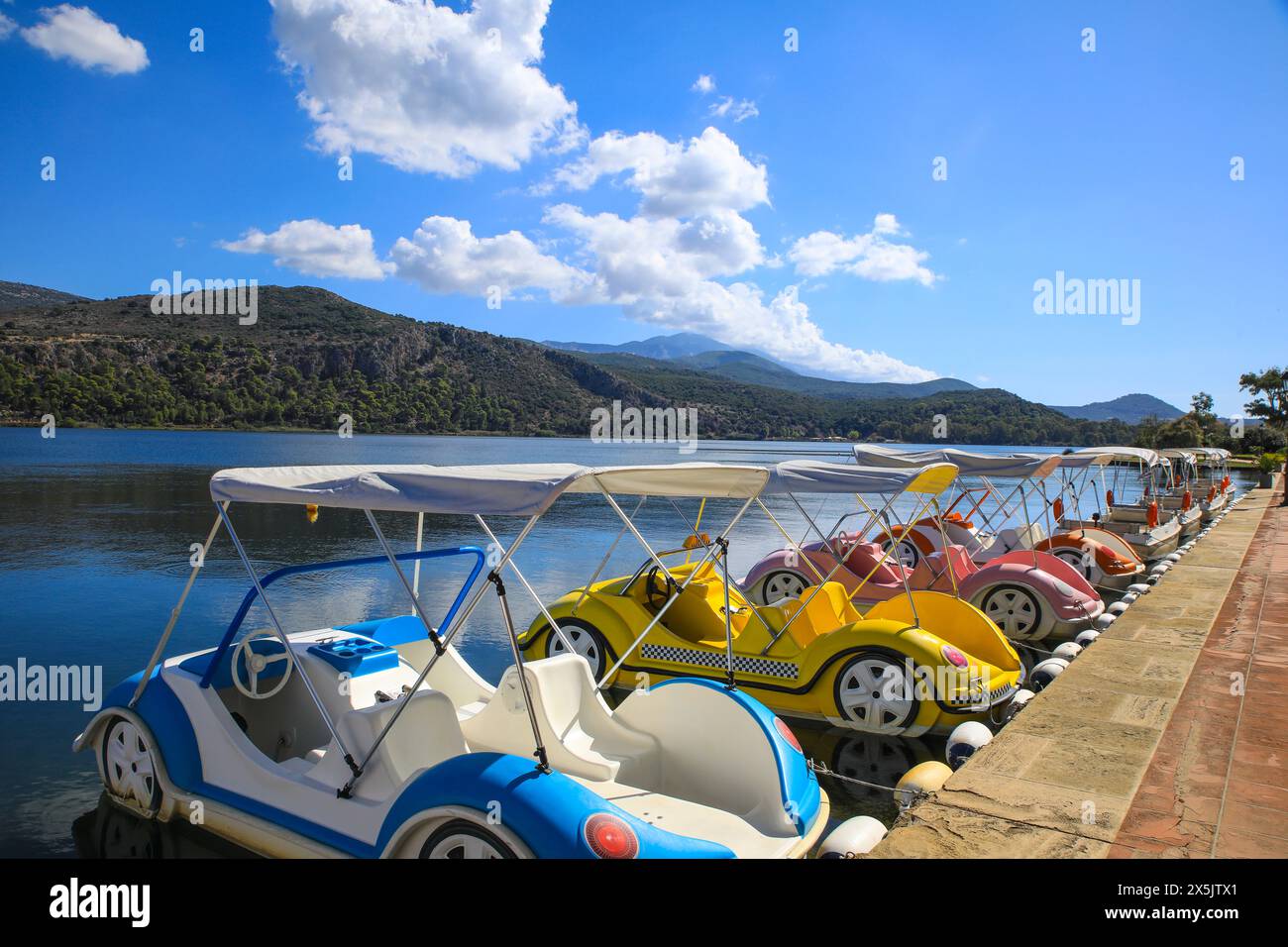 Kefalonia, Argostoli Greece, water car peddle boats for the water on a bay. (Editorial Use Only) Stock Photo