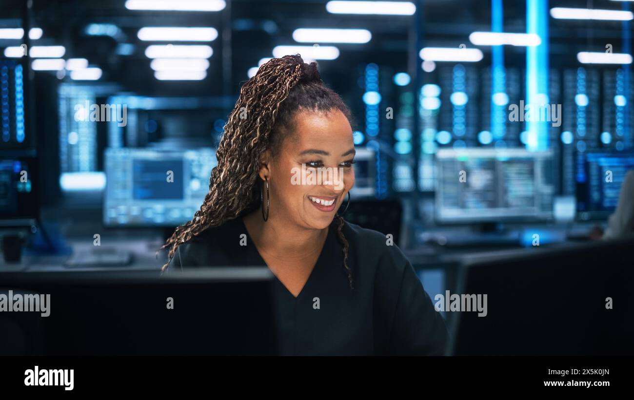 Professional IT Programer Working in Data Center on Desktop Computer with Two Displays, while Doing Development of Software and Hardware. Data Network and IT Technologies Concept Stock Photo