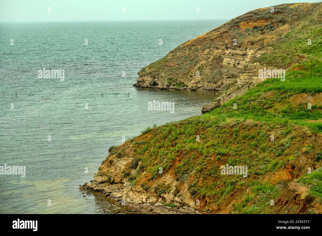 The Parpach limestone crest breaks off in the Crimea into the Sea of Azov. Belongs to the category of low mountains, neogene limestones. Table-land sh Stock Photo