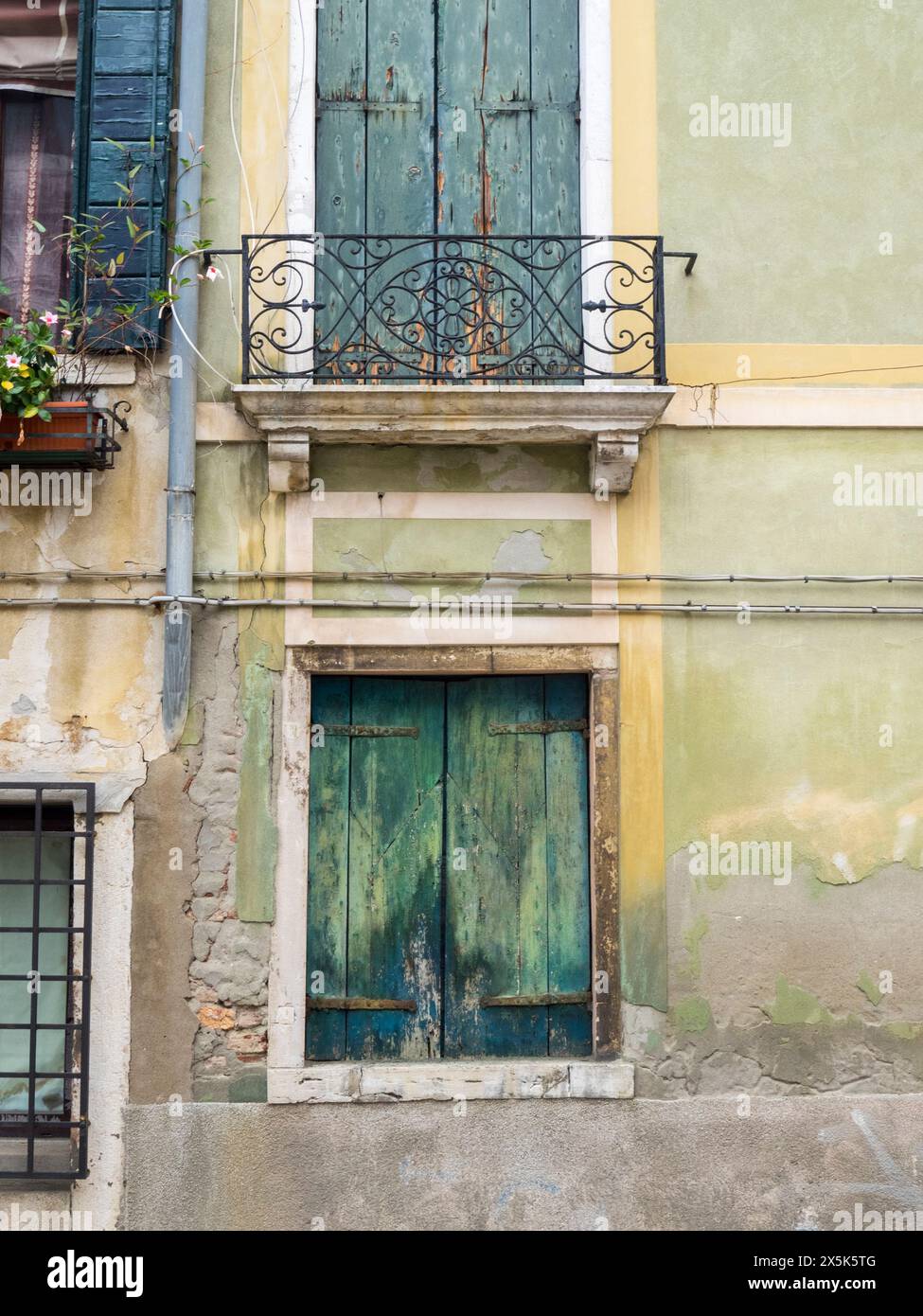 Italy, Venice. Window and balcony of an old building Venice. Stock Photo