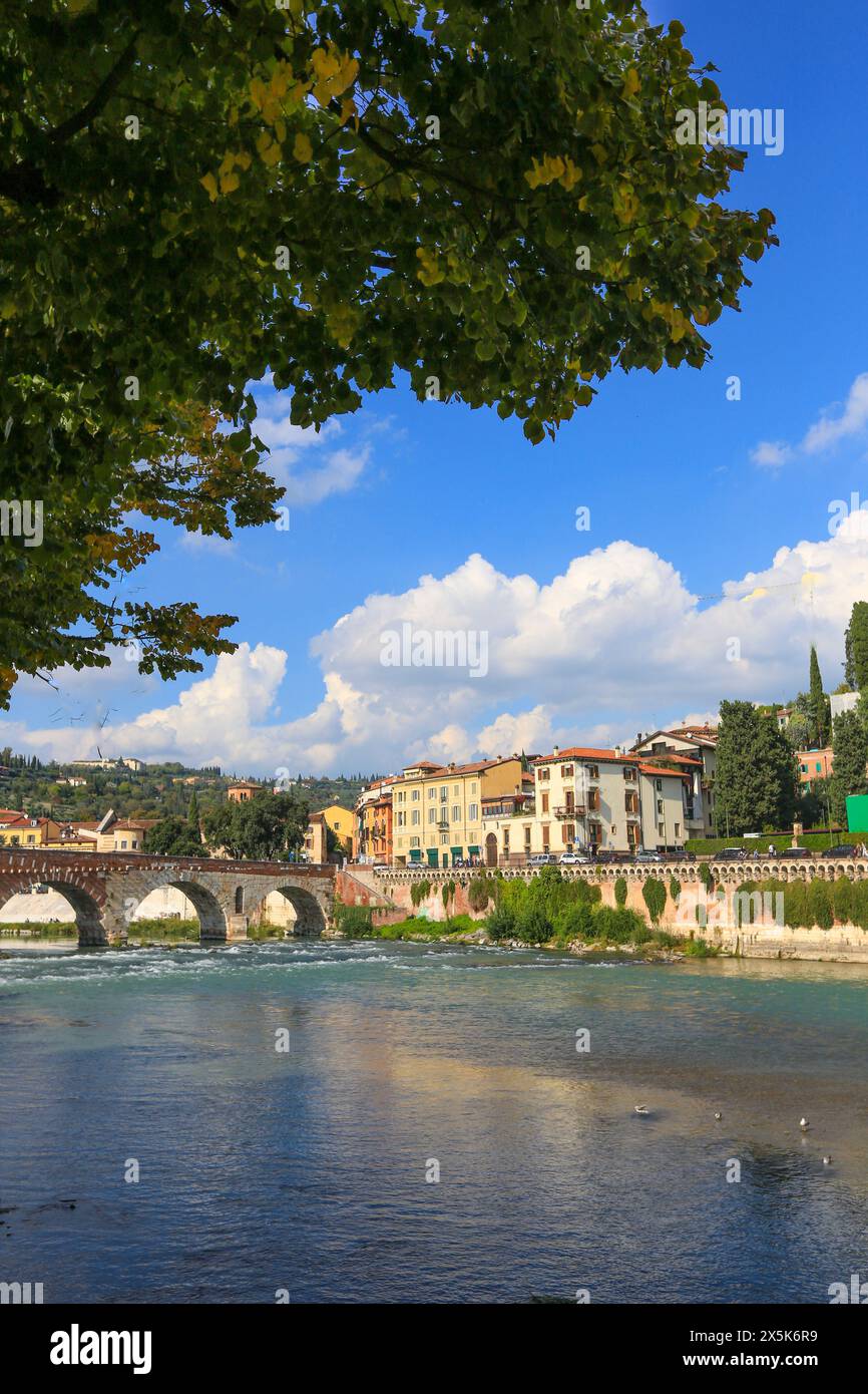 Verona, Italy. Adige River and arched bridge with Italian stucco ...