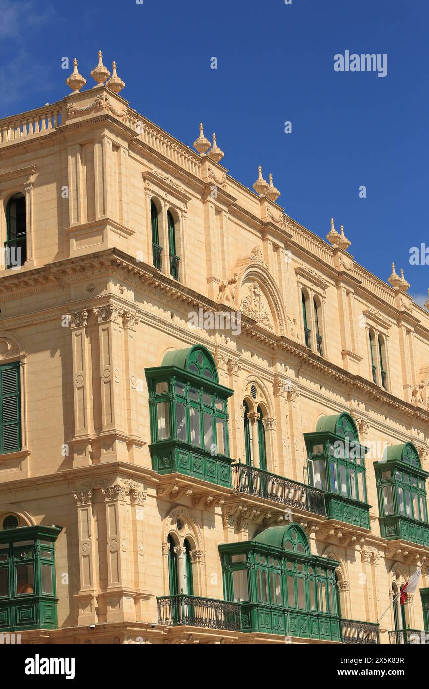 Valletta, Malta. Ornate green balconies on a baroque limestone building Stock Photo