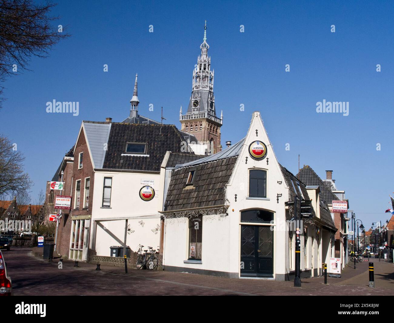 Restaurant and shops and the clock and bell tower of the Great Church ...