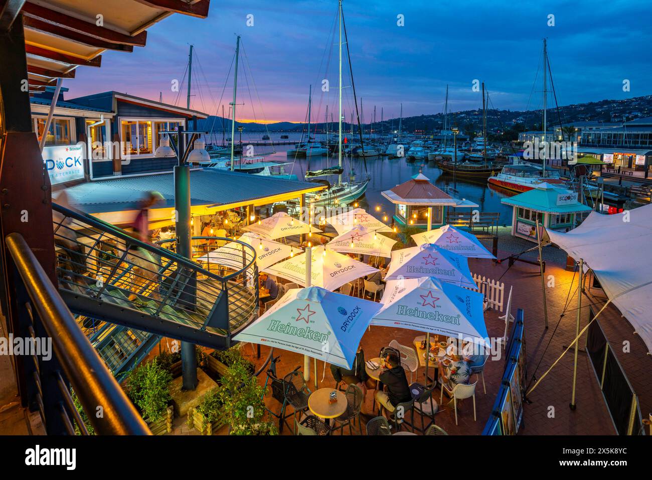 View of boats and restaurants at Knysna Waterfront at dusk, Knysna, Western Cape Province, South Africa, Africa Copyright: FrankxFell 844-33434 Stock Photo