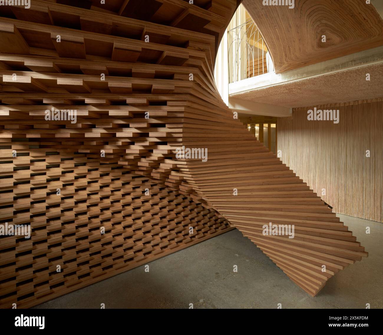 Sculptural curvaceous timber staircase. ACME Offices, London, United Kingdom. Architect: ACME, 2024. Stock Photo