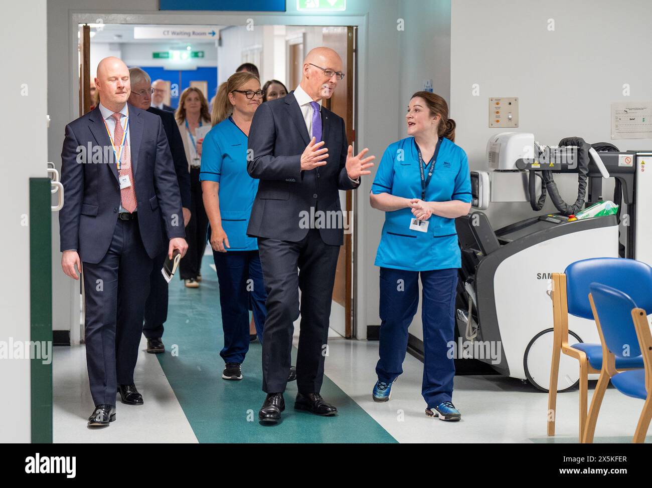 First Minister John Swinney meets staff during a visit to see a new CT scanner which delivers additional diagnostic capacity at St John's Hospital, Livingston, West Lothian. Picture date: Friday May 10, 2024. Stock Photo