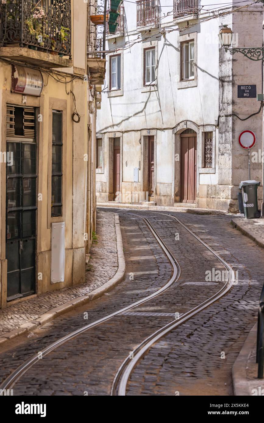 Portugal, Lisbon. Trolley tracks in a winding street Stock Photo - Alamy