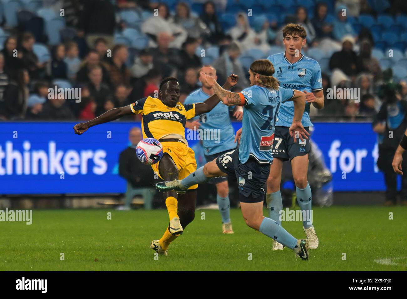 Sydney, Australia. 10th May, 2024. Alou Mawien Kuol (L) of Central Coast Mariners, Hayden Matthews (back) and Nathan Luke Brattan (R) of Sydney FC team seen in action during the Isuzu UTE A-League 2023-24 season semi-final Leg 1 match between Sydney FC and Central Coast Mariners FC at Allianz Stadium. Final score; Sydney FC 1:2 Central Coast Mariners. Credit: SOPA Images Limited/Alamy Live News Stock Photo