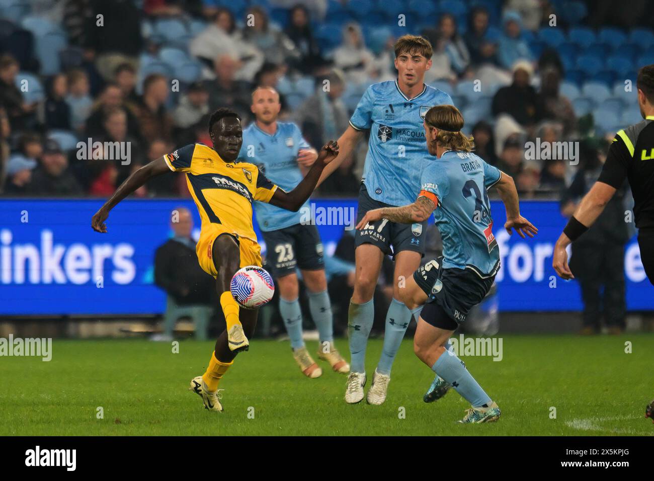 Sydney, Australia. 10th May, 2024. Alou Mawien Kuol (L) of Central Coast Mariners, Hayden Matthews (back) and Nathan Luke Brattan (R) of Sydney FC team seen in action during the Isuzu UTE A-League 2023-24 season semi-final Leg 1 match between Sydney FC and Central Coast Mariners FC at Allianz Stadium. Final score; Sydney FC 1:2 Central Coast Mariners. Credit: SOPA Images Limited/Alamy Live News Stock Photo