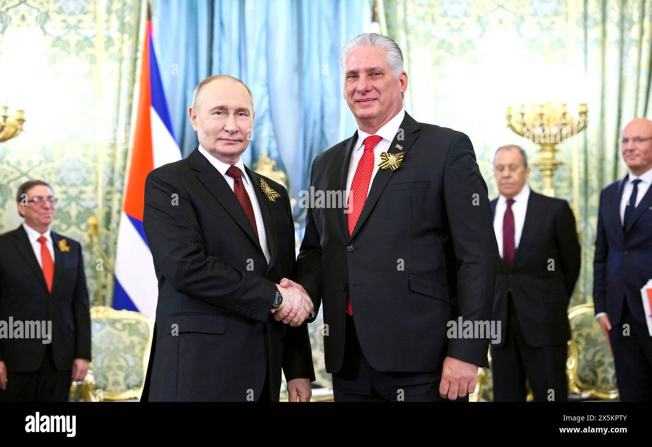 Moscow, Russia. 09th May, 2024. Russian President Vladimir Putin shakes ...