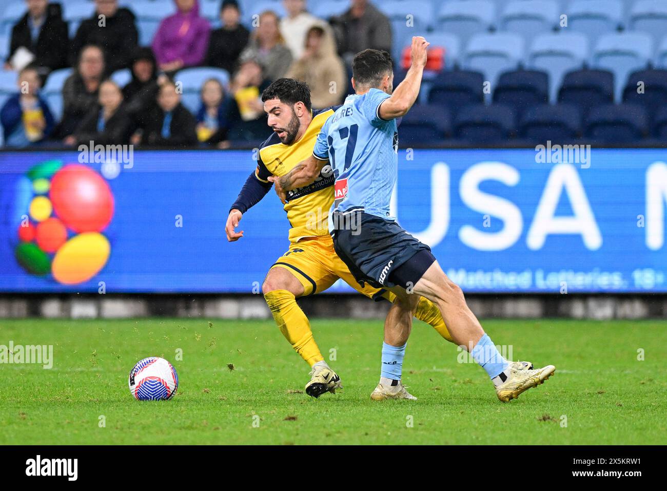 10th May 2024;  Allianz Stadium, Sydney, NSW, Australia: A-League Football,  Finals Series, Semi Final, First Leg, Sydney FC versus Central Coast Mariners; Anthony Caceres of Sydney FC fouls Christian Theoharous of the Central Coast Mariners in the penalty area and concedes a penalty kick Stock Photo