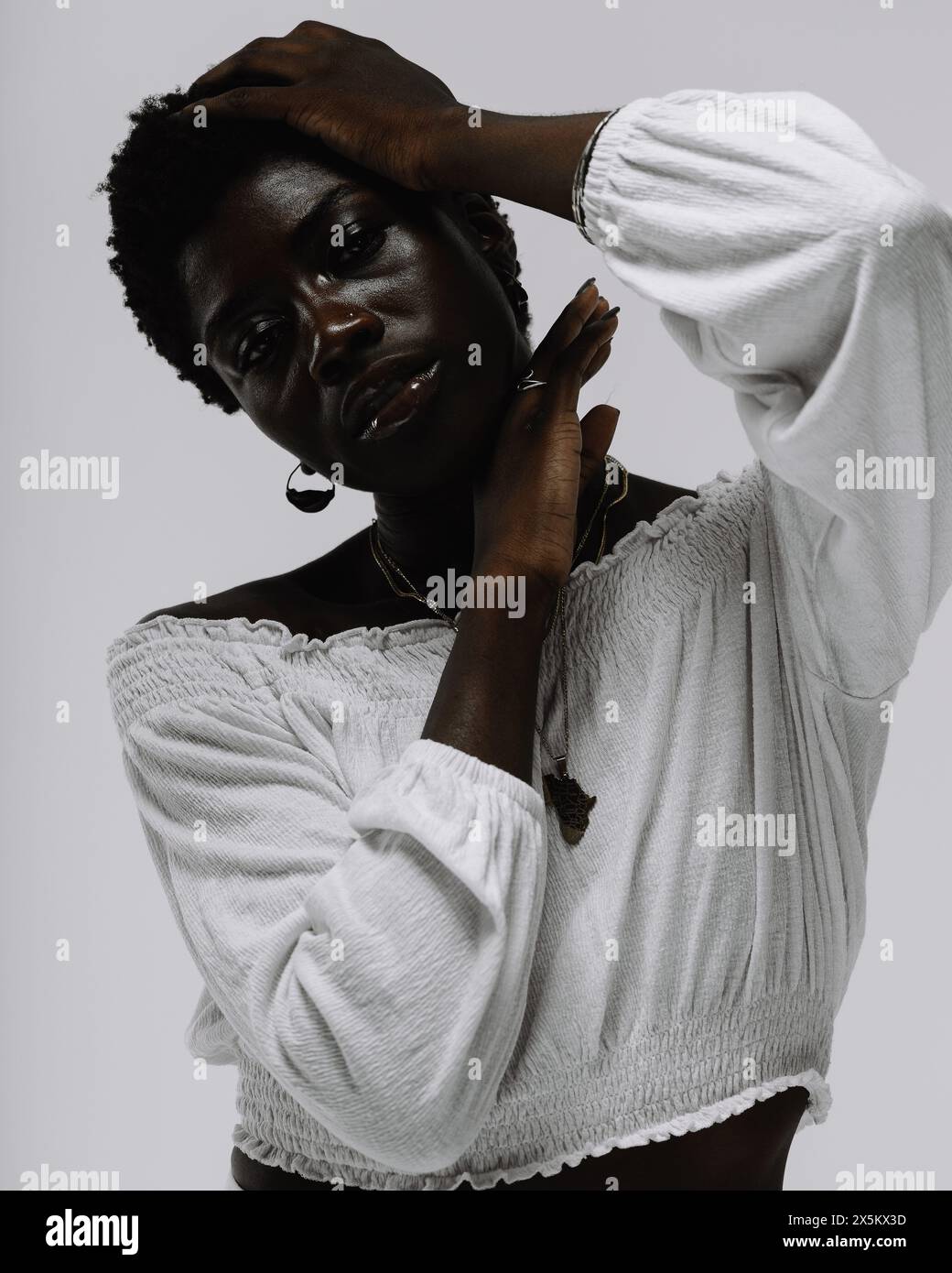 Curly black woman in white hi-res stock photography and images - Alamy