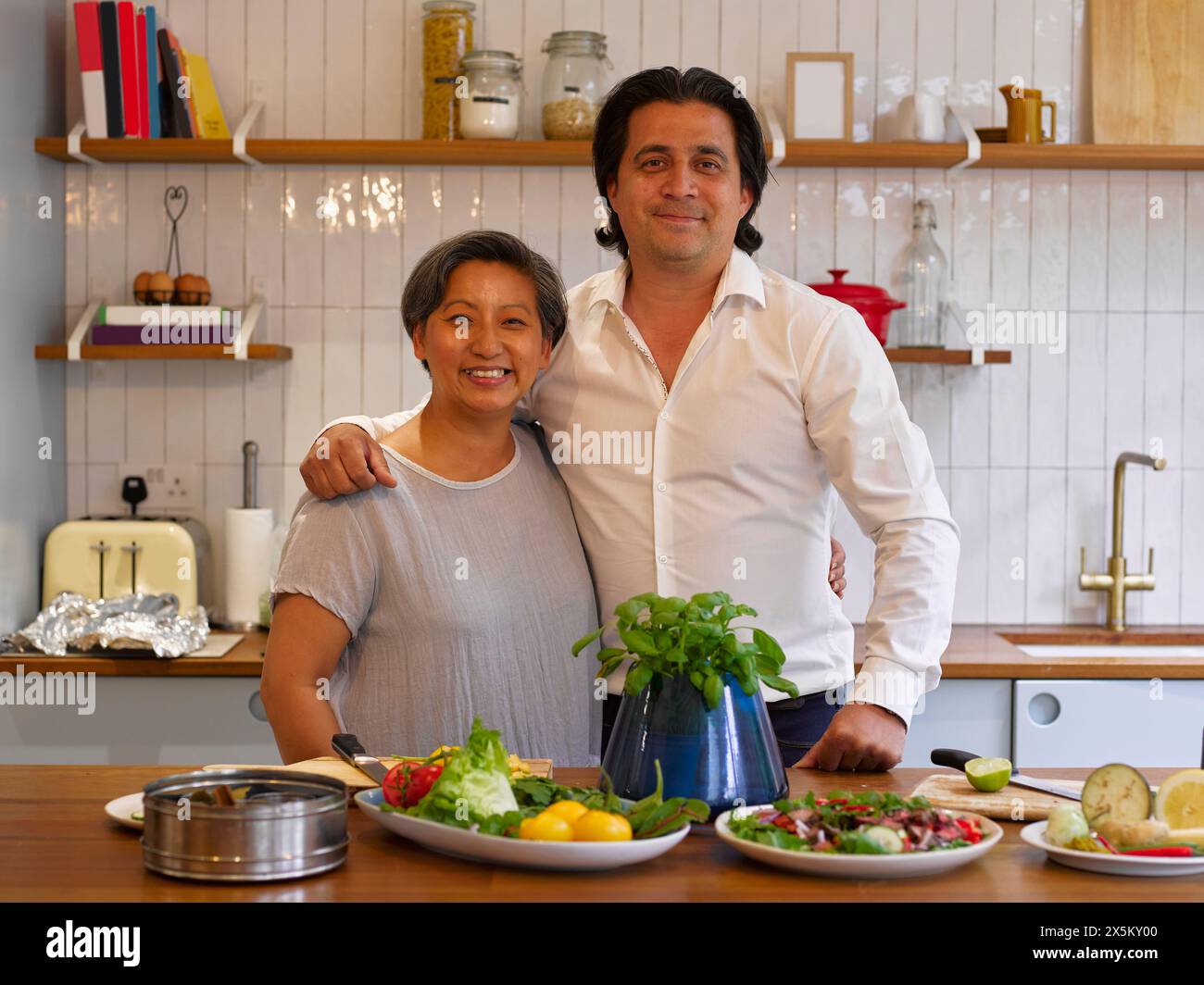 Man arm around woman group hi-res stock photography and images - Alamy