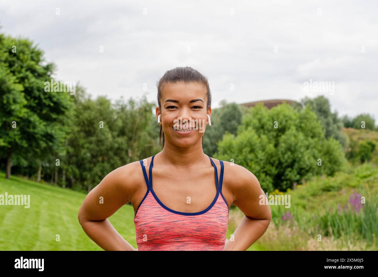 Portrait of smiling woman in nature Stock Photo