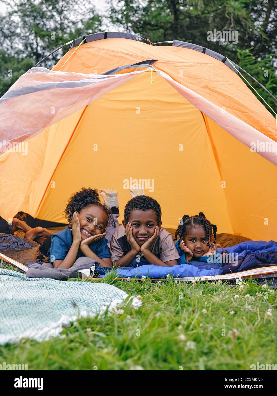siblings-lying-in-tent-stock-photo-alamy