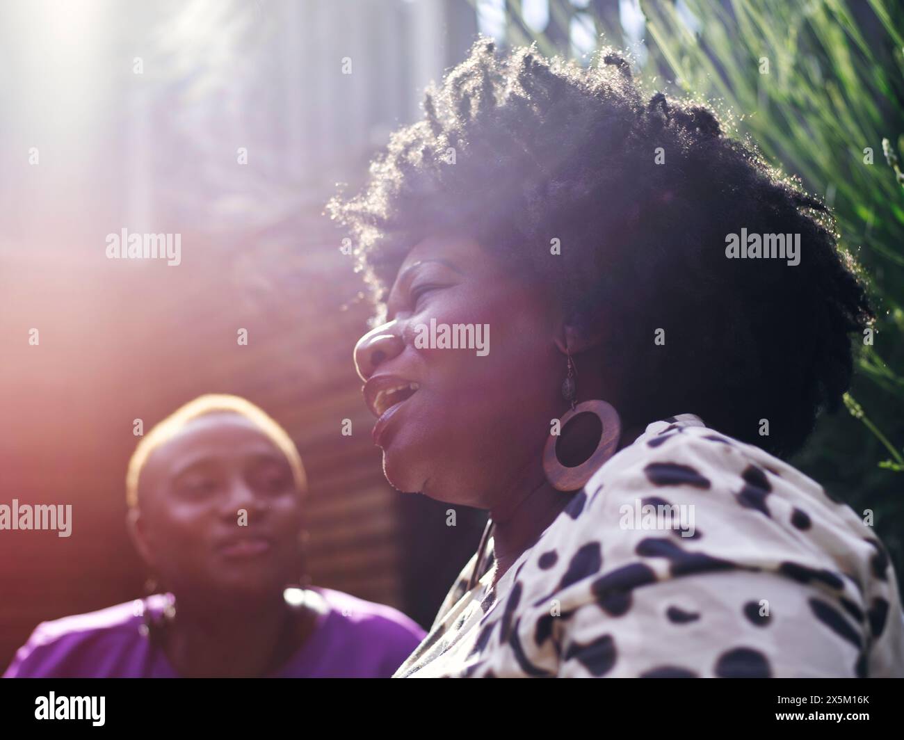 Two women in light hi-res stock photography and images - Alamy