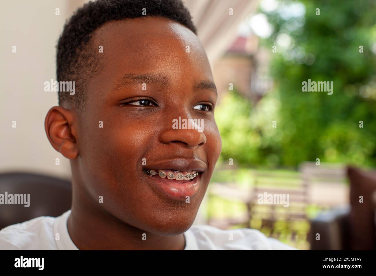 Smiling teenage boy with dental braces Stock Photo