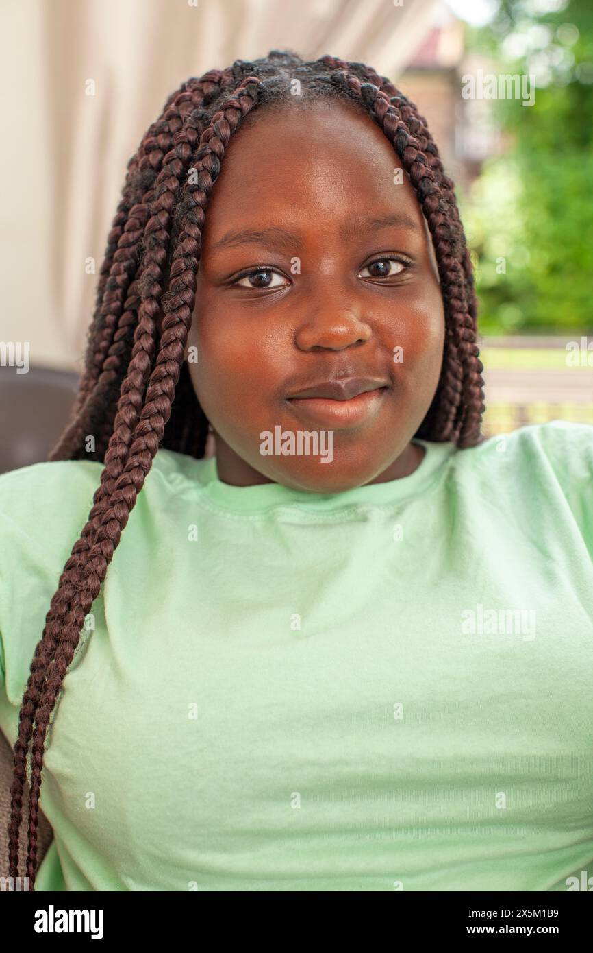 Portrait of smiling girl with braided hair Stock Photo - Alamy