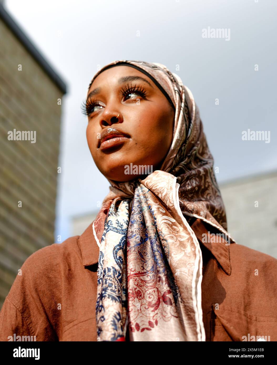 UK, London, Portrait of young woman wearing hijab outdoors Stock Photo