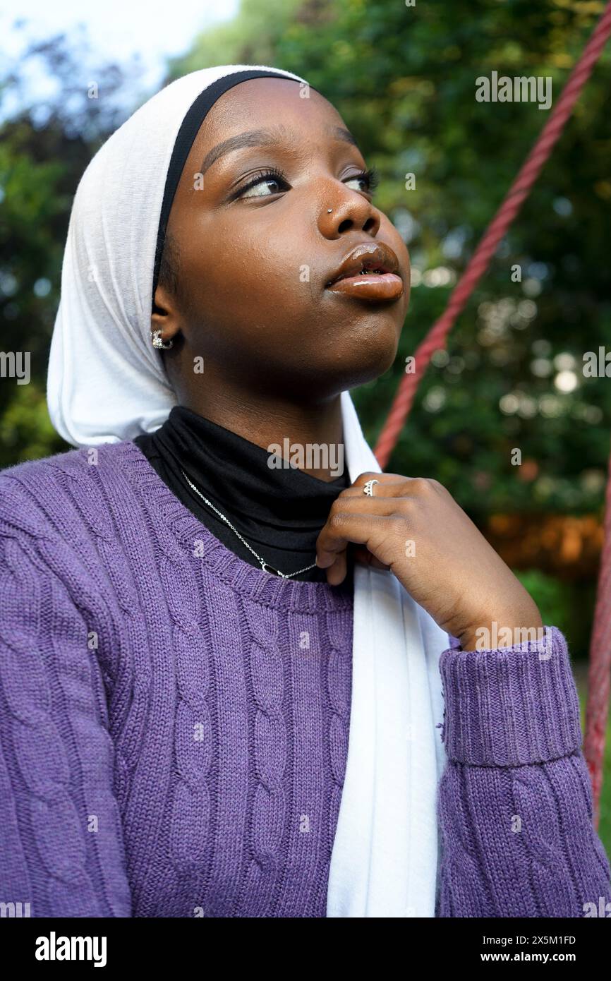 UK, London, Portrait of young woman wearing hijab outdoors Stock Photo