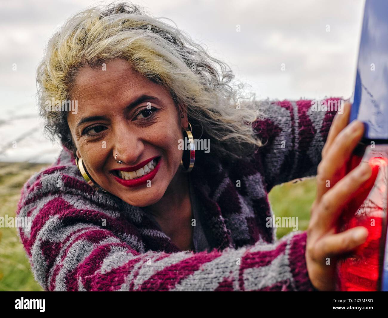 Woman pushing broken car Stock Photo