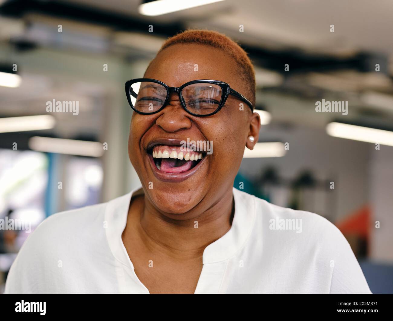 Laughing african woman in glasses hi-res stock photography and images ...