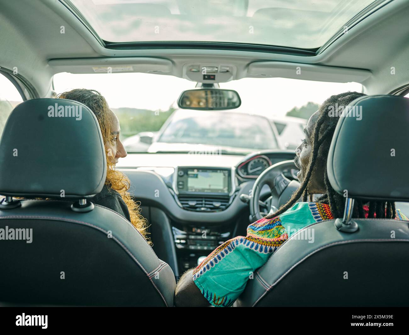 Rear Man Man driving car uk rear view hi-res stock photography and images - Alamy