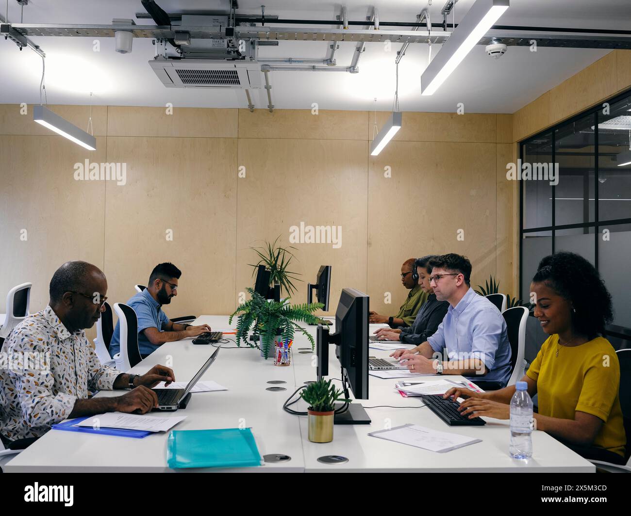Office Worker Using Technology Black business co workers using hi-res stock photography and images - Alamy