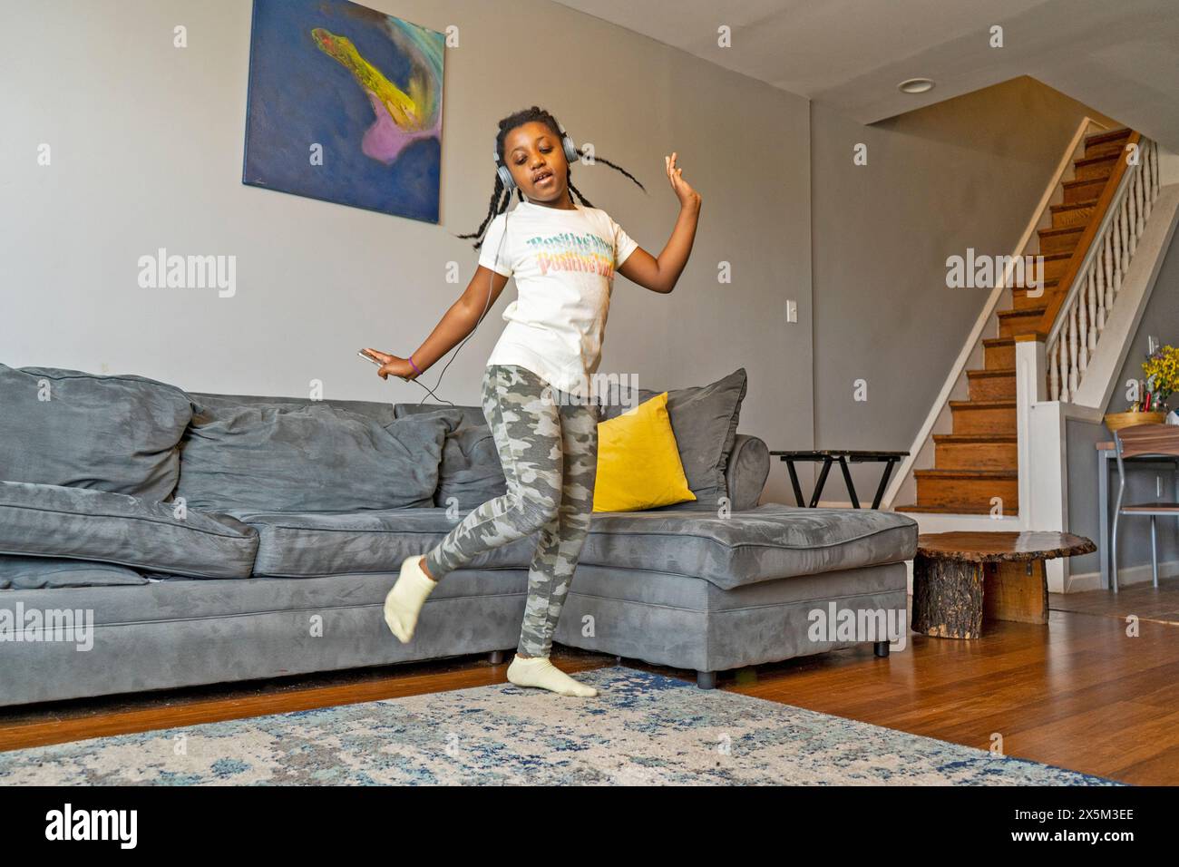 Girl in headphones dancing home hi-res stock photography and images - Alamy