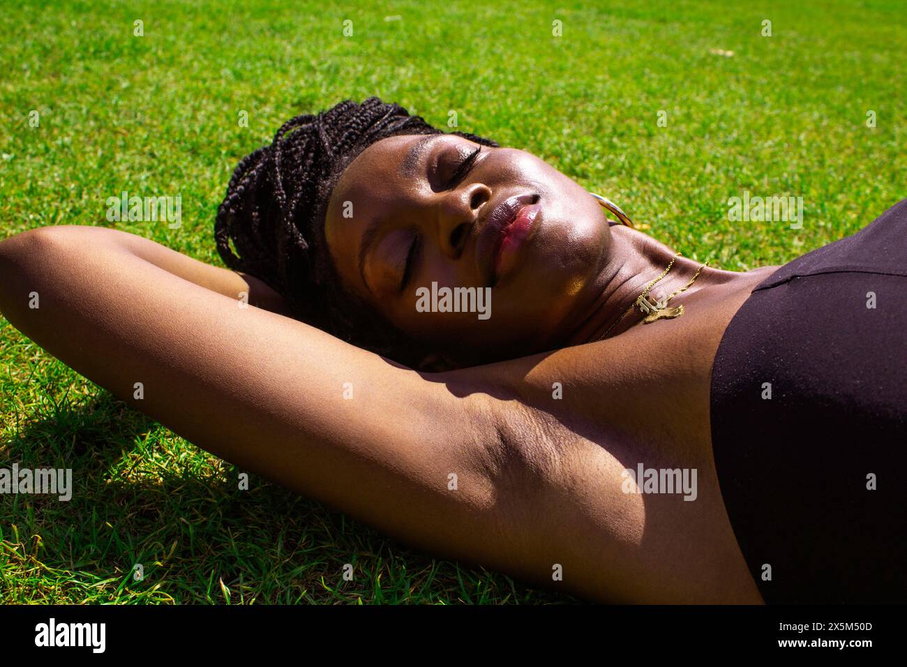 African woman lying on hi-res stock photography and images - Alamy