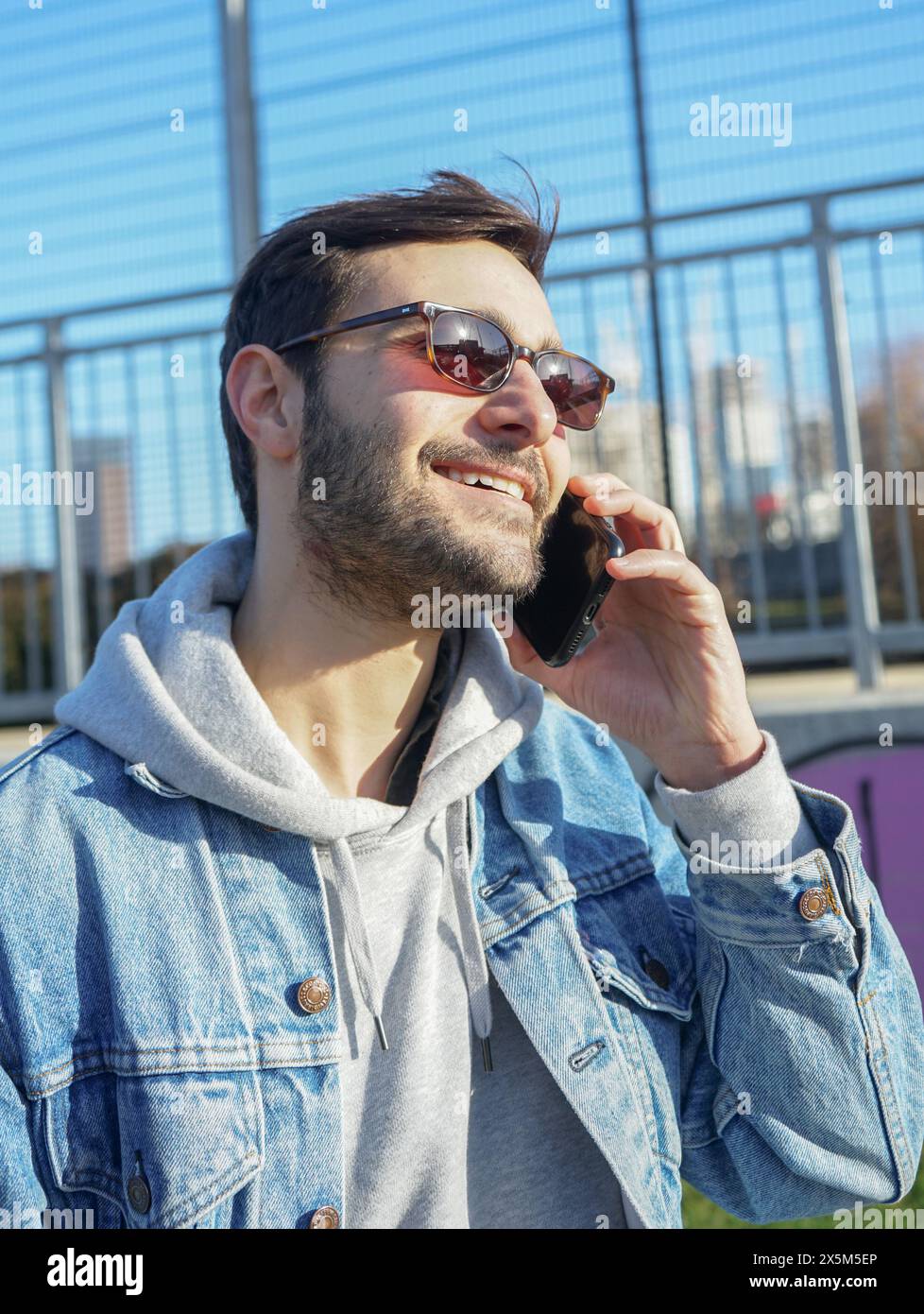 Man brunette talking on phone hi-res stock photography and images - Alamy