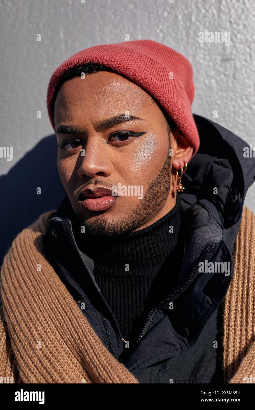 USA, New York City, Portrait of queer man in warm clothing Stock Photo