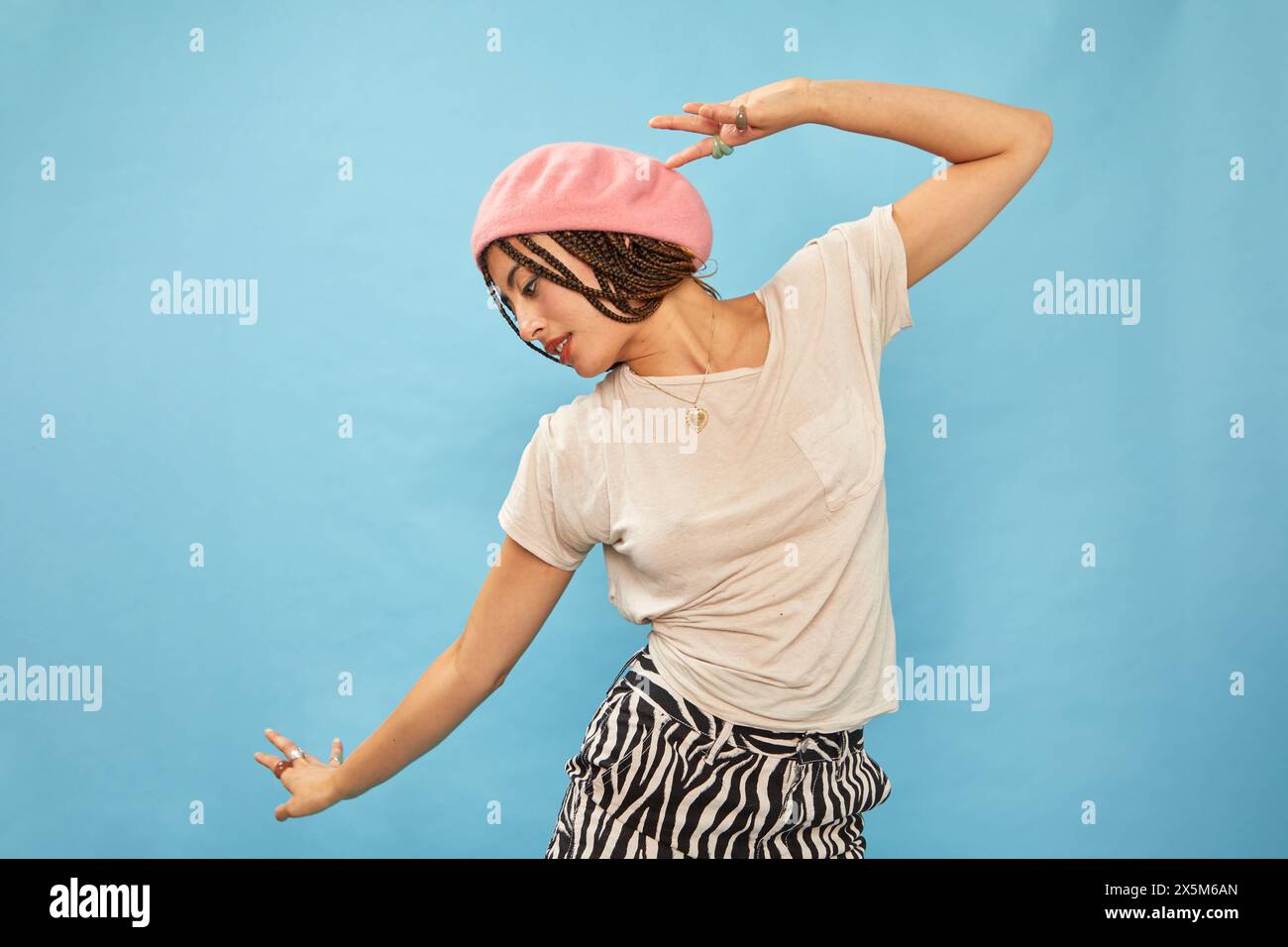 Studio shot of stylish woman in pink beret Stock Photo