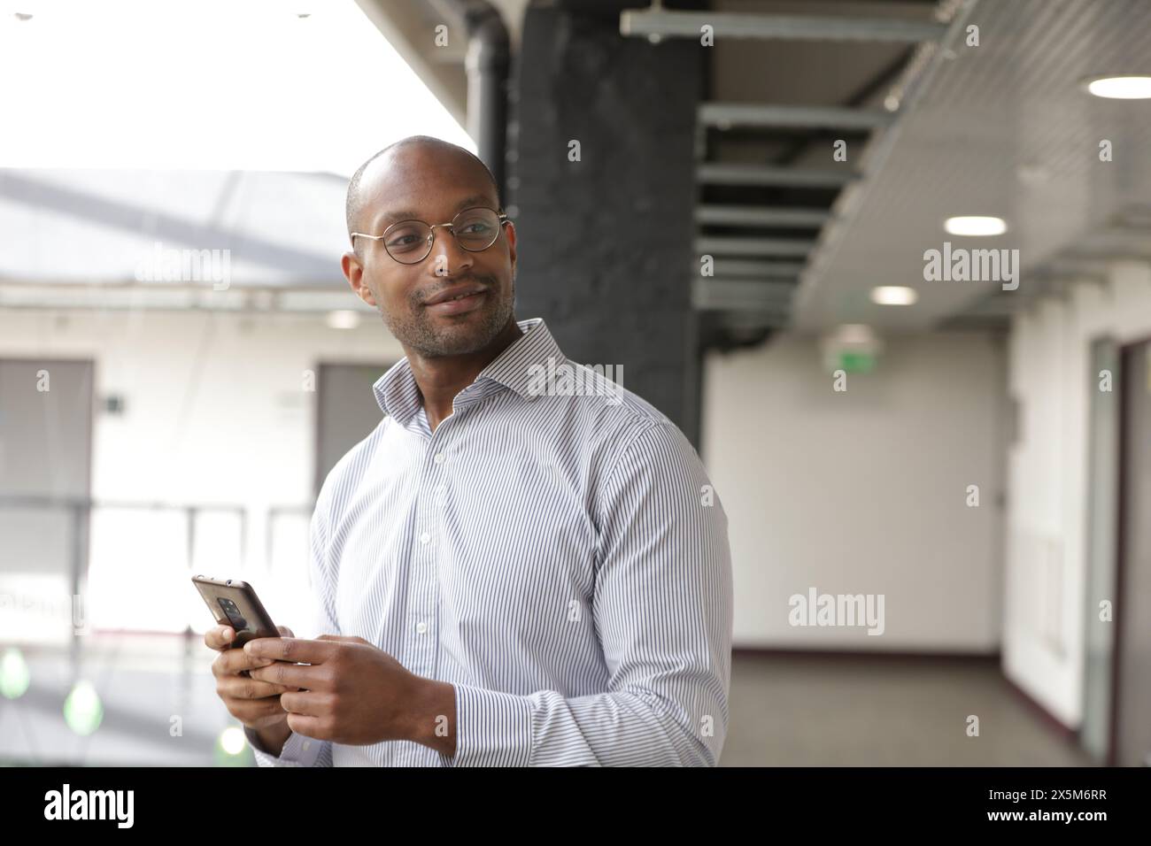 Businessman using smart phone Stock Photo