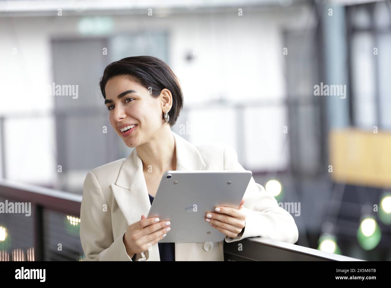 Smiling businesswoman using tablet Stock Photo