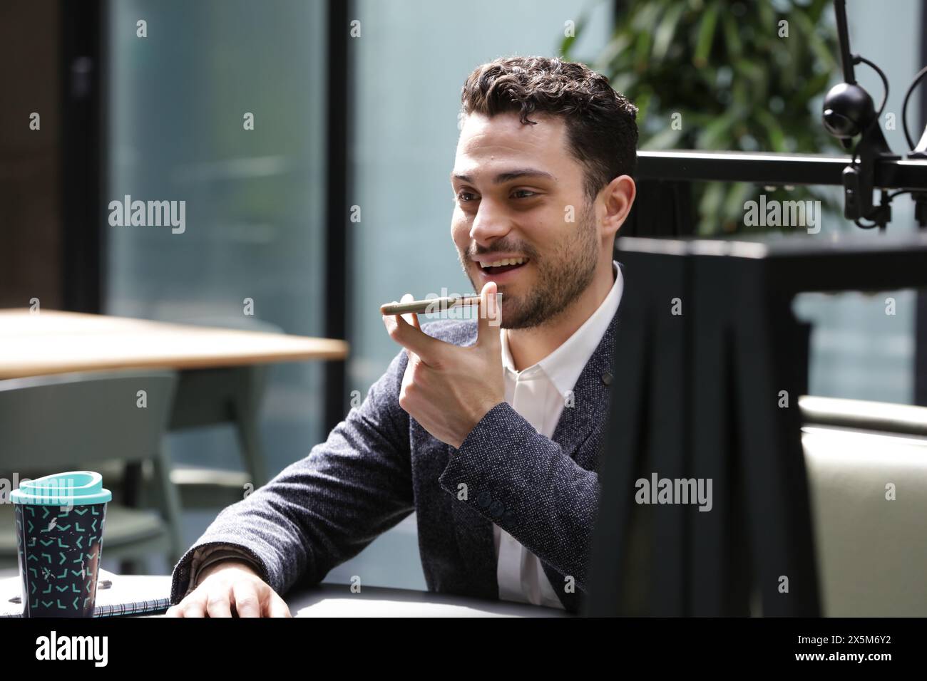 Smiling businessman talking on phone Stock Photo