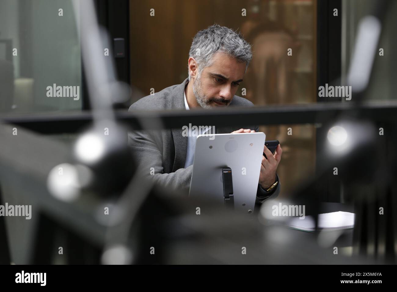Businessman using smart phone and tablet Stock Photo