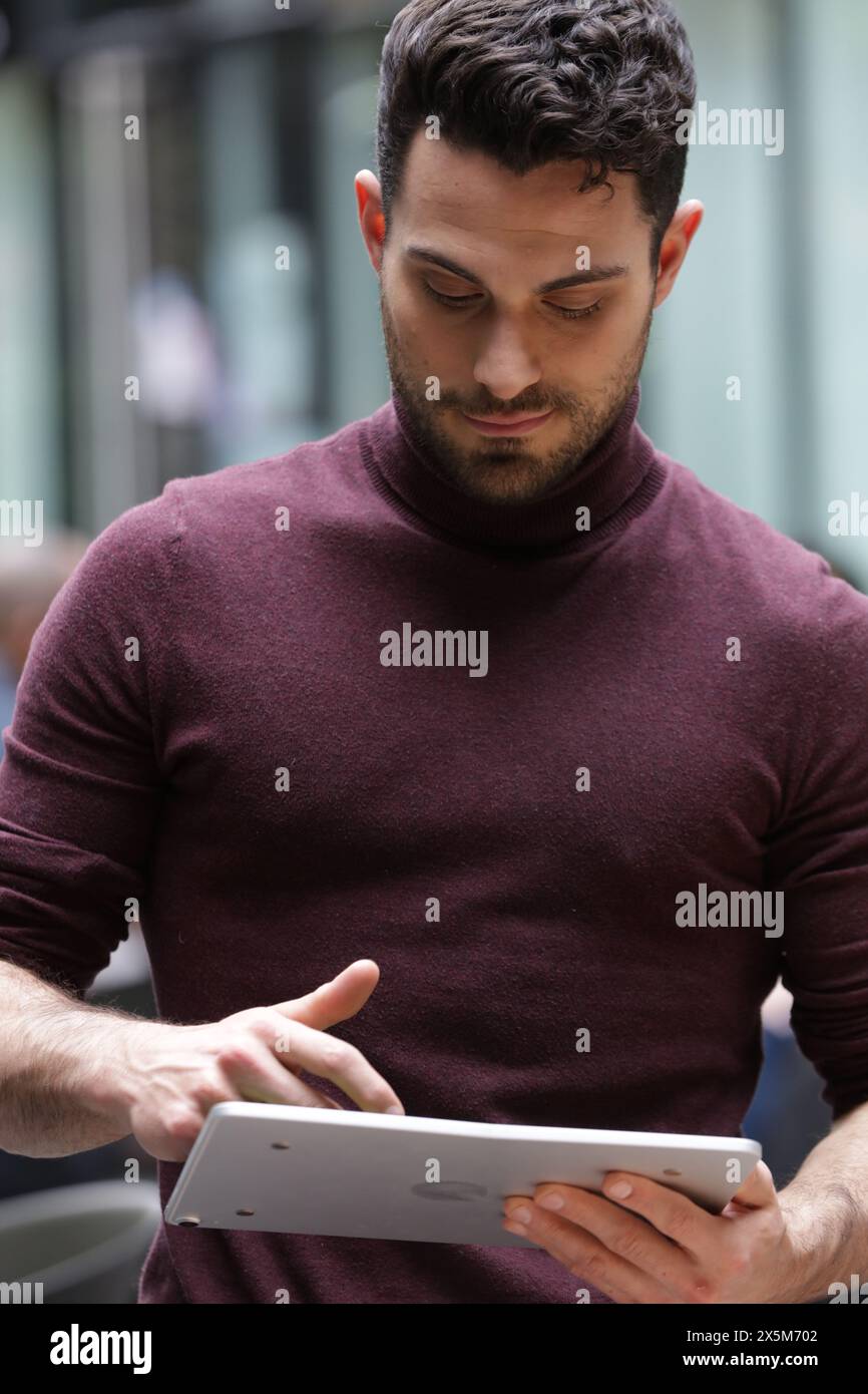 Young businessman using tablet in office Stock Photo