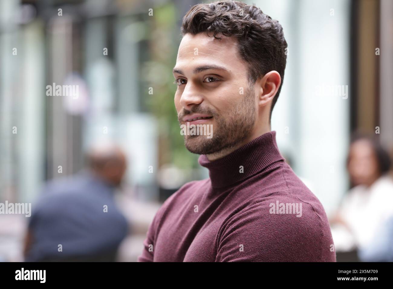 Smiling young businessman in office Stock Photo