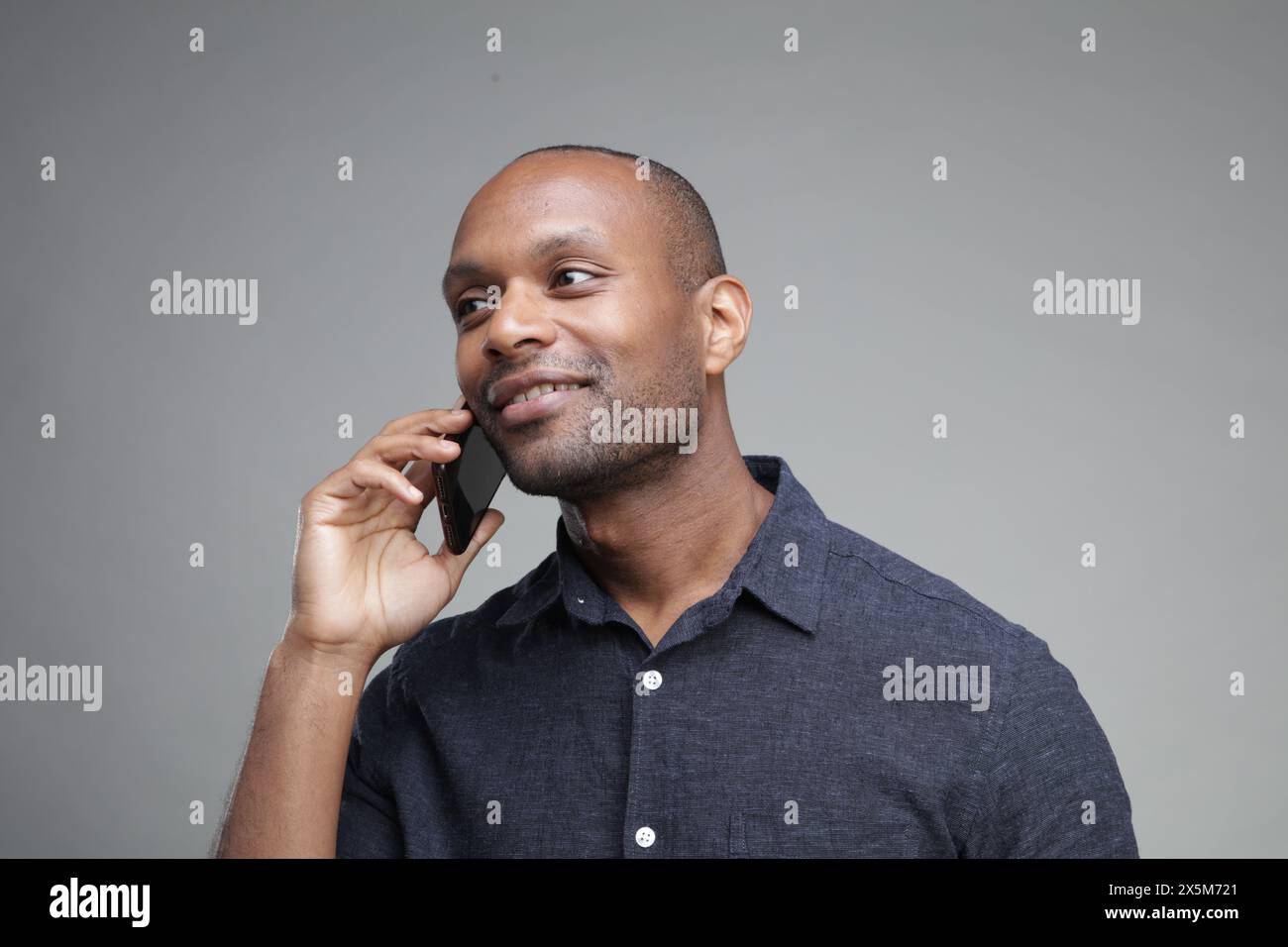 Businessman talking on phone Stock Photo