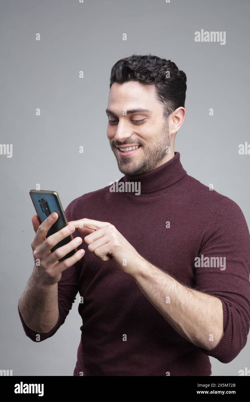 Young man using smart phone Stock Photo