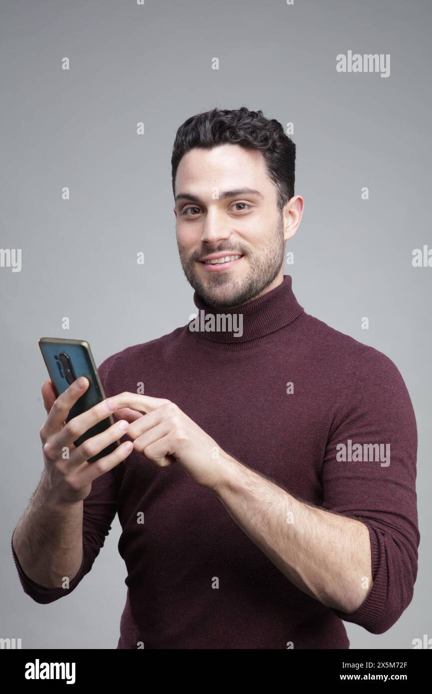 Young man using smart phone Stock Photo