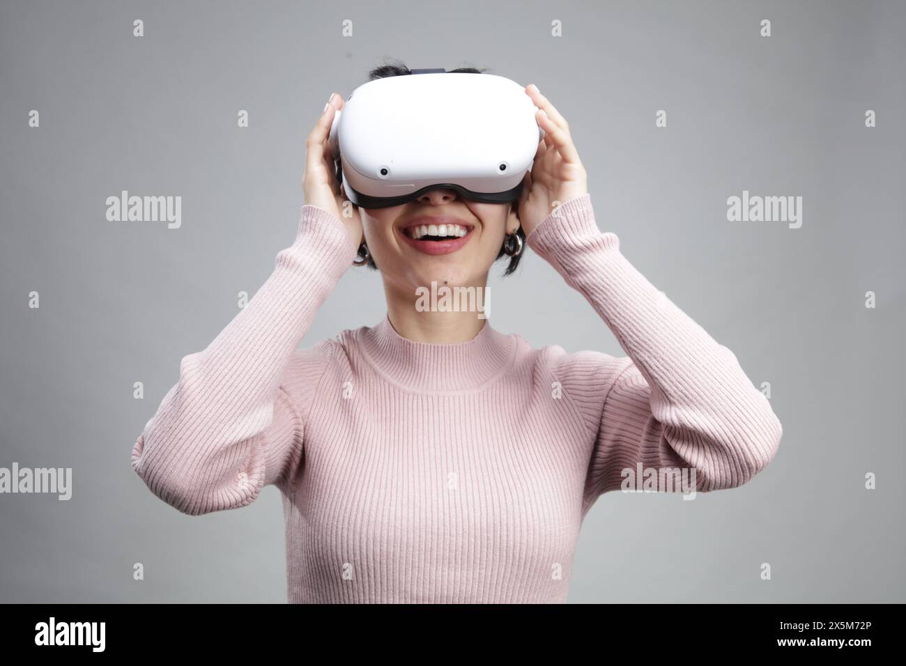 Young woman using virtual reality headset Stock Photo