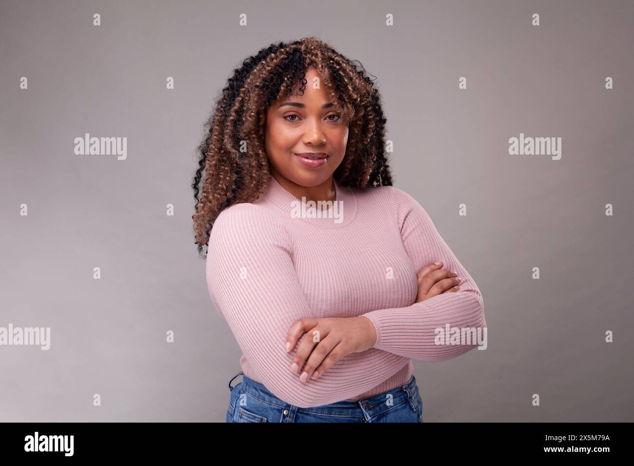African woman crossed arms hi-res stock photography and images - Alamy